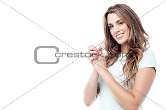 Smiling woman with clasped hands