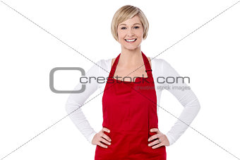 Smiling woman chef posing over white