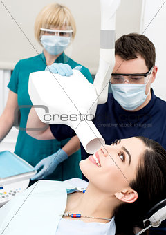 Female patient examined dental x-ray