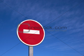 Road sign against clear deep blue sky