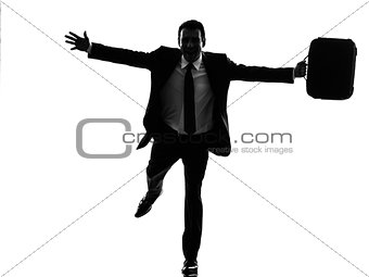 business man running happy arms outstretched silhouette