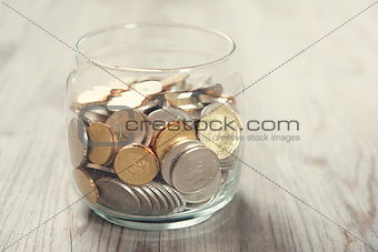 Coins in glass money jar