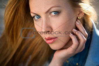 fashion portrait of strict red-haired girl