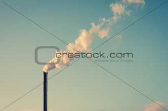 Factory with smoking chimney