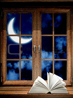 Open book on windowsill