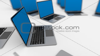 3d render of a lot of laptops in a row. 