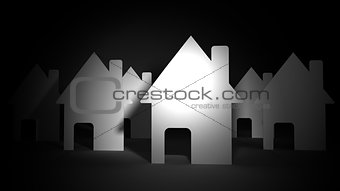 Paper houses on black background