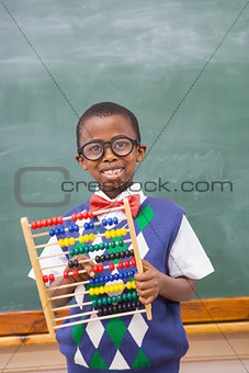 Smiling pupil holding abacus