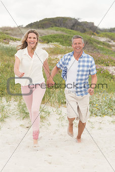 Casual couple walking holding hands