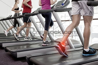 Highlighted ankle of man on treadmill