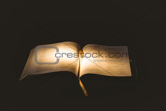 Light shining on open bible