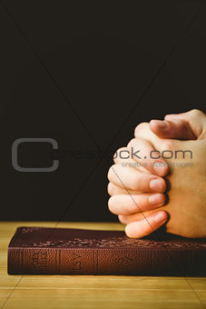 Man praying with his bible
