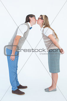 Geeky hipster couple kissing