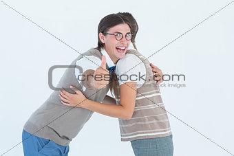 Geeky hipster couple hugging