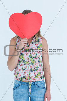 Woman holding heart card