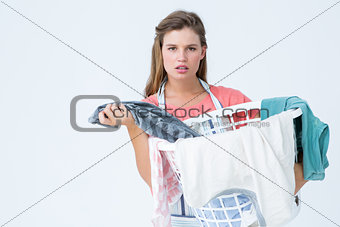Hipster woman holding laundry basket
