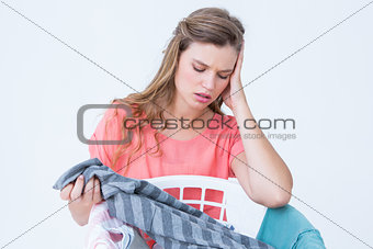 Hipster looking at laundry basket