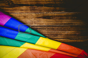Gay pride flag on wooden table
