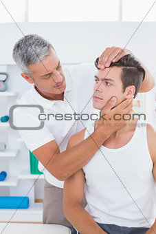Doctor doing neck adjustment