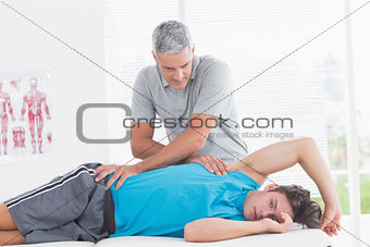 Doctor examining his patient back