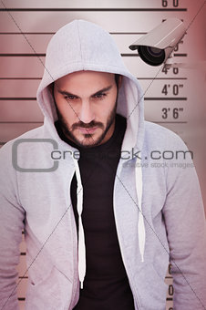 Composite image of portrait of dangerous man wearing hooded jacket