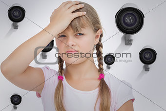 Composite image of little girl suffering from headache