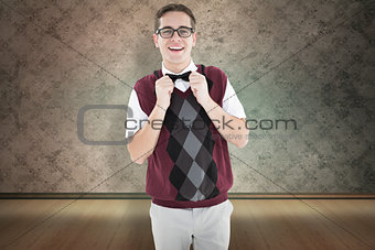 Composite image of geeky hipster fixing his bow tie