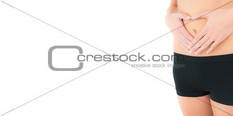 Closeup mid section of a fit woman in black shorts