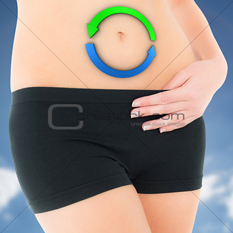 Composite image of closeup mid section of a fit woman in black shorts