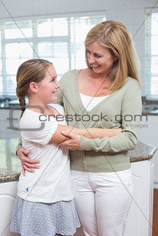 Happy mother and daughter embracing