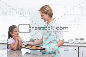 Mother and daughter with hot fresh cookies