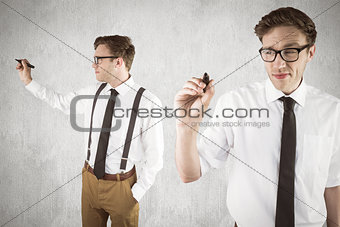 Composite image of nerdy businessman writing