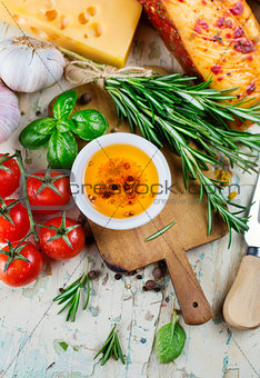 Olive oil with spices and cherry tomatoes