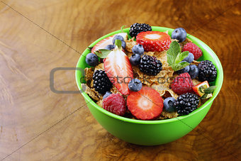 homemade granola muesli with berries (strawberries, raspberries, blueberries) for breakfast