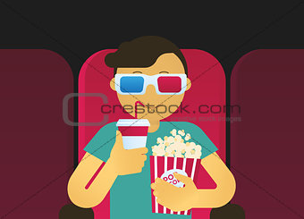 Young guy sitting in the cinema