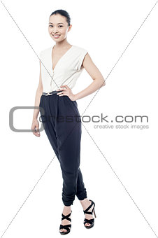 Smiling woman posing with one hand on hip