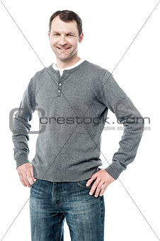 Smiling man with hands on hips