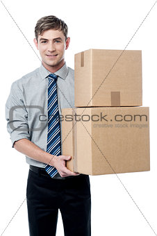Young man with with stack of boxes