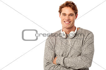 Handsome smiling man with folded arms