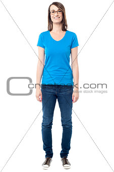 Casual middle aged woman posing over white