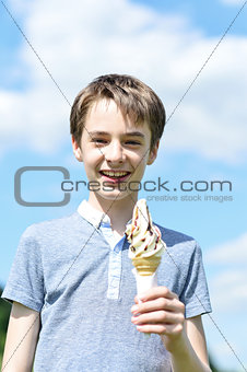 Smiling boy posing with an ice cream