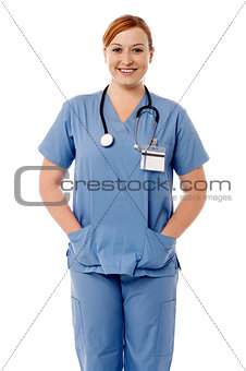 Smiling female nurse standing with stethoscope