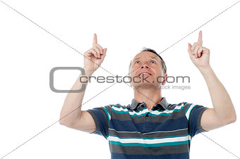 Caucasian man pointing up his fingers