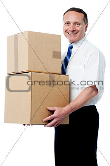 Business executive holding a boxes