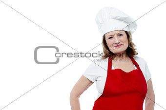 Aged female chef posing in style