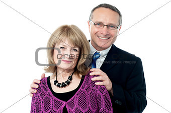 Elderly couple smiling to the camera