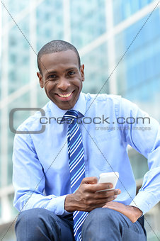 Business executive using his smart phone