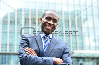 Confident businessman outside his office
