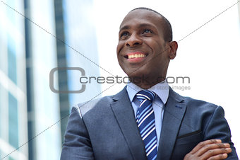 Smiling black businessman at outdoors
