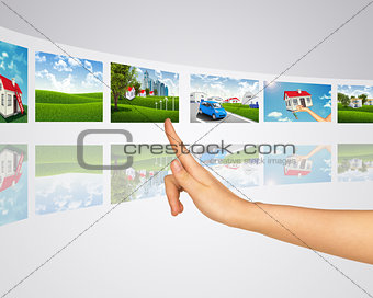 Subject homes for sale. Finger presses one of virtual screens